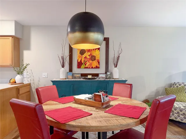 a kitchen with stainless steel appliances granite countertop a sink and cabinets with wooden floor