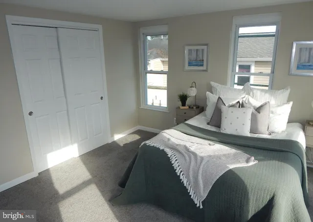 a bedroom with a bed and window