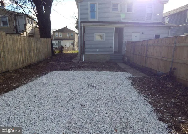 a view of a house with a yard and garage