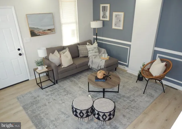 a living room with furniture and a rug