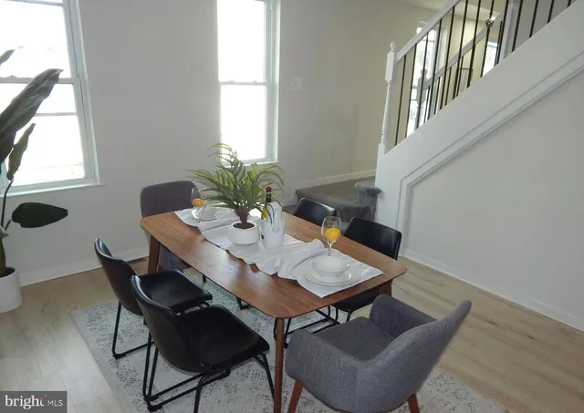 a view of a dining room with furniture and window