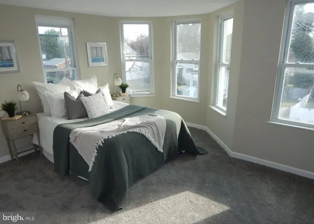 a bedroom with bed and window