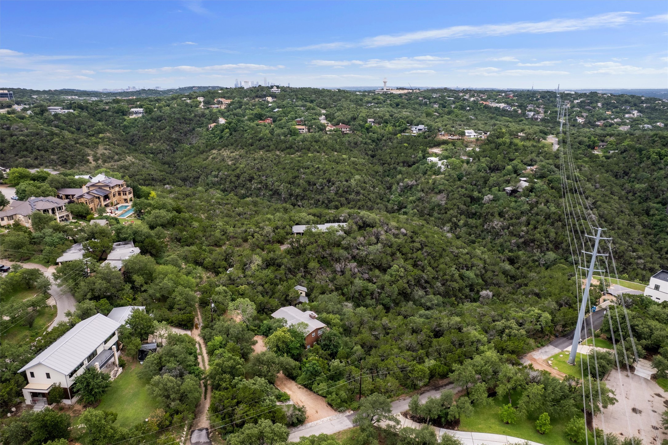 501 Drawbridge Road Austin, TX 78746 - Photo 3 of 6 A second story could yield panoramic views stretching across the hill country and all the way to downtown Austin.