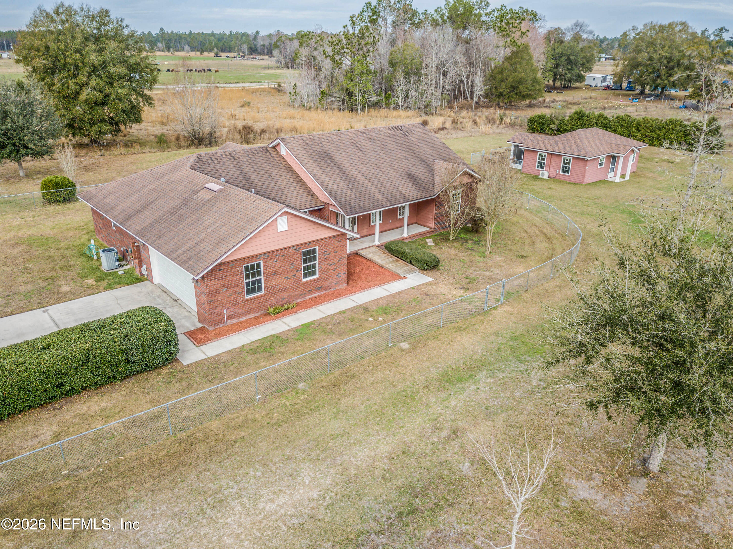 18100 Crews Road Glen St. Mary, FL 32040 - Photo 1 of 75 an aerial view of a house with outdoor space and lake view