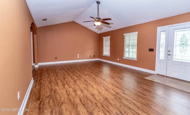 a bathroom with a glass door shower