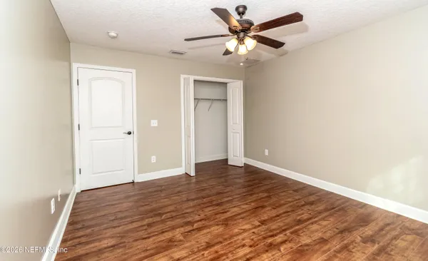 a view of a kitchen with a dishwasher cabinets and a window