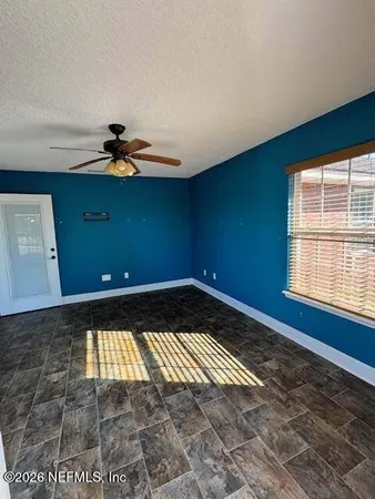 a front view of a house with swimming pool having outdoor seating