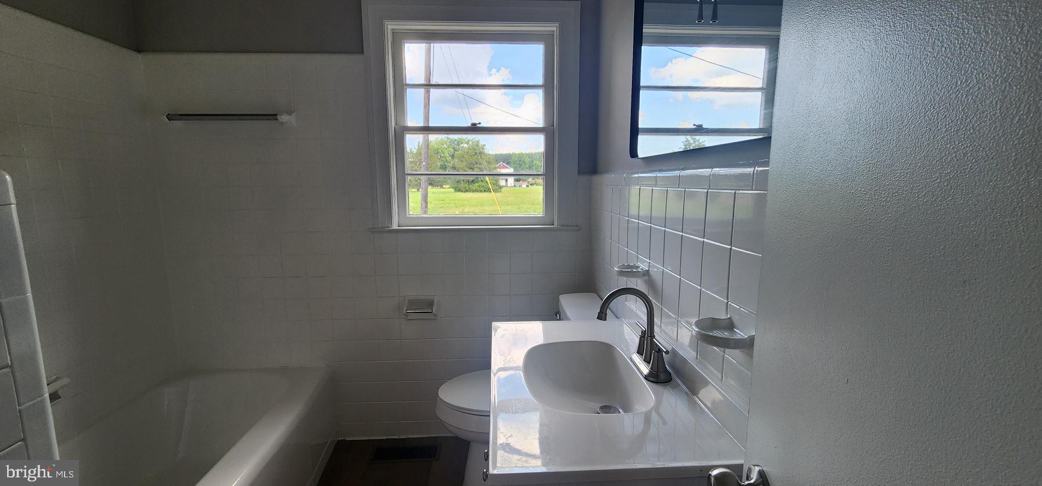 8432 Meadow Bridge Road Eden, MD 21822 - Photo 33 of 42 Bright and airy bathroom with scenic views.