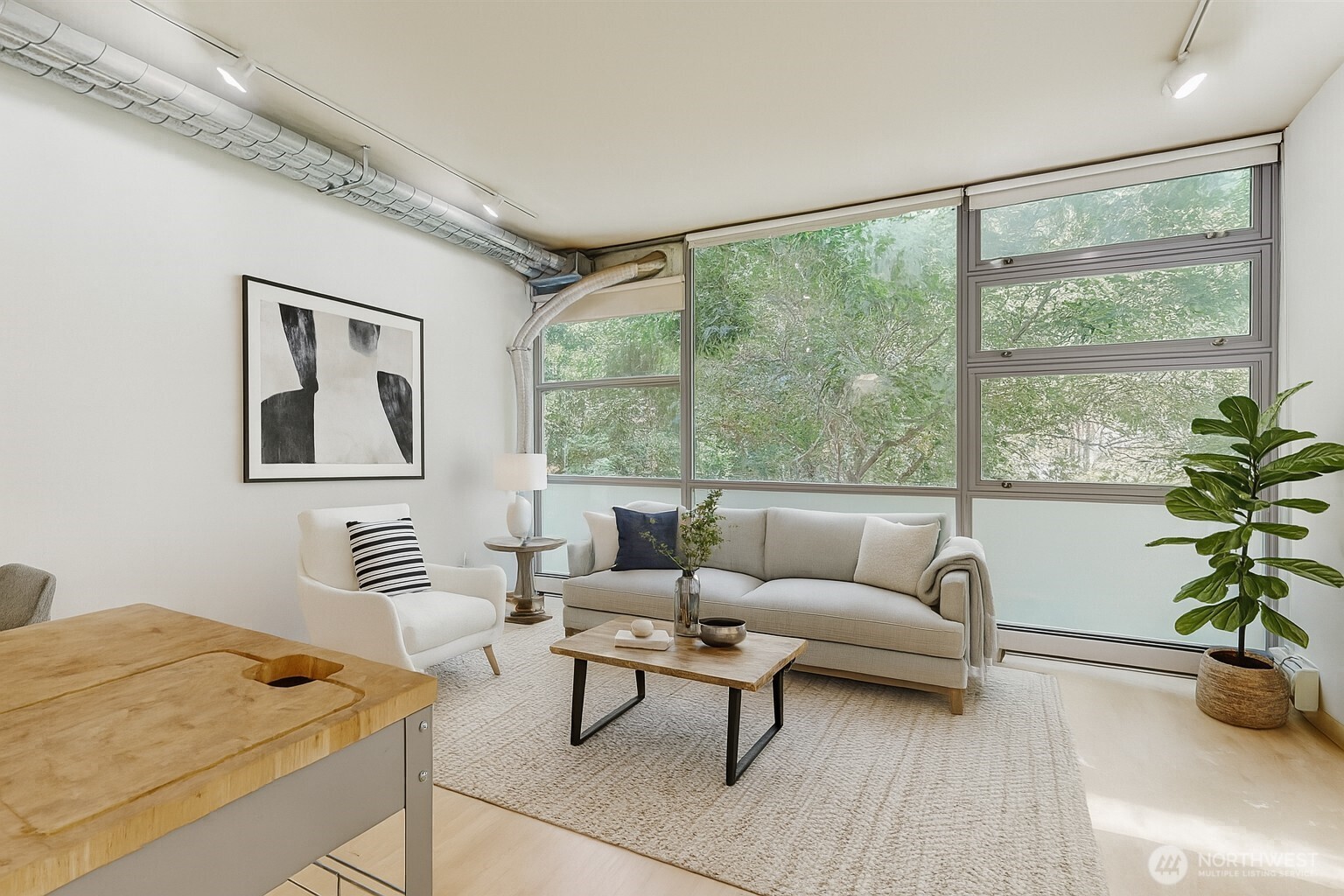 2015 Terry Avenue, Unit 301 Seattle, WA 98121 - Photo 3 of 15 a living room with furniture and a large window