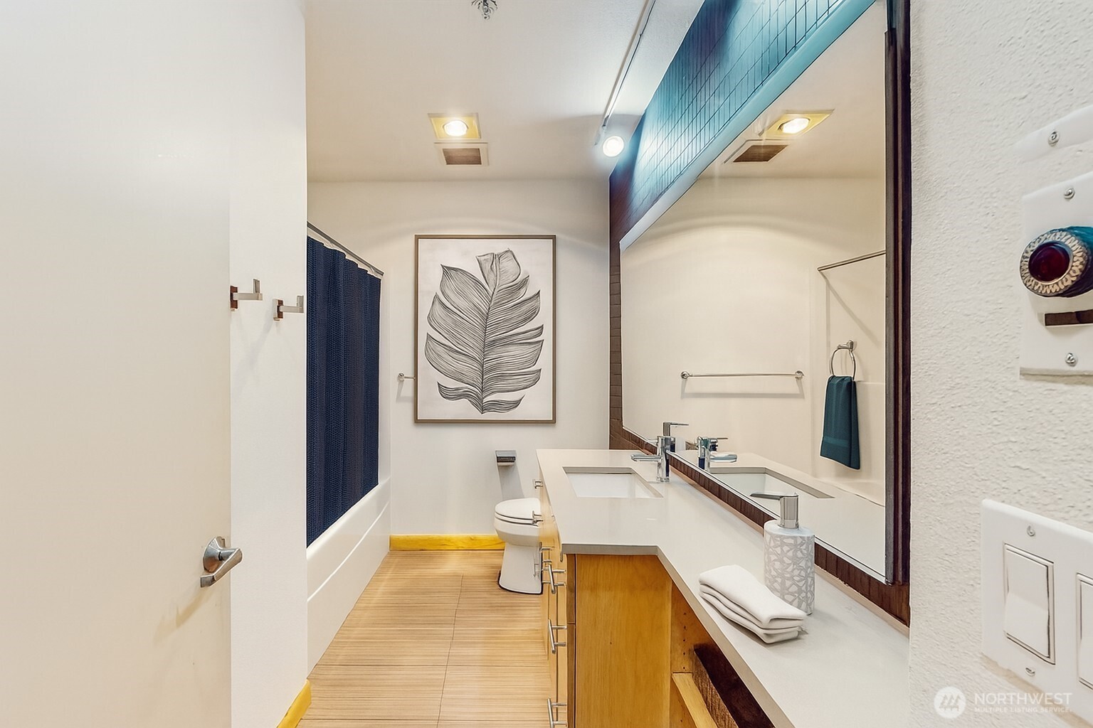 2015 Terry Avenue, Unit 301 Seattle, WA 98121 - Photo 3 of 14 a bathroom with a tub sink and mirror