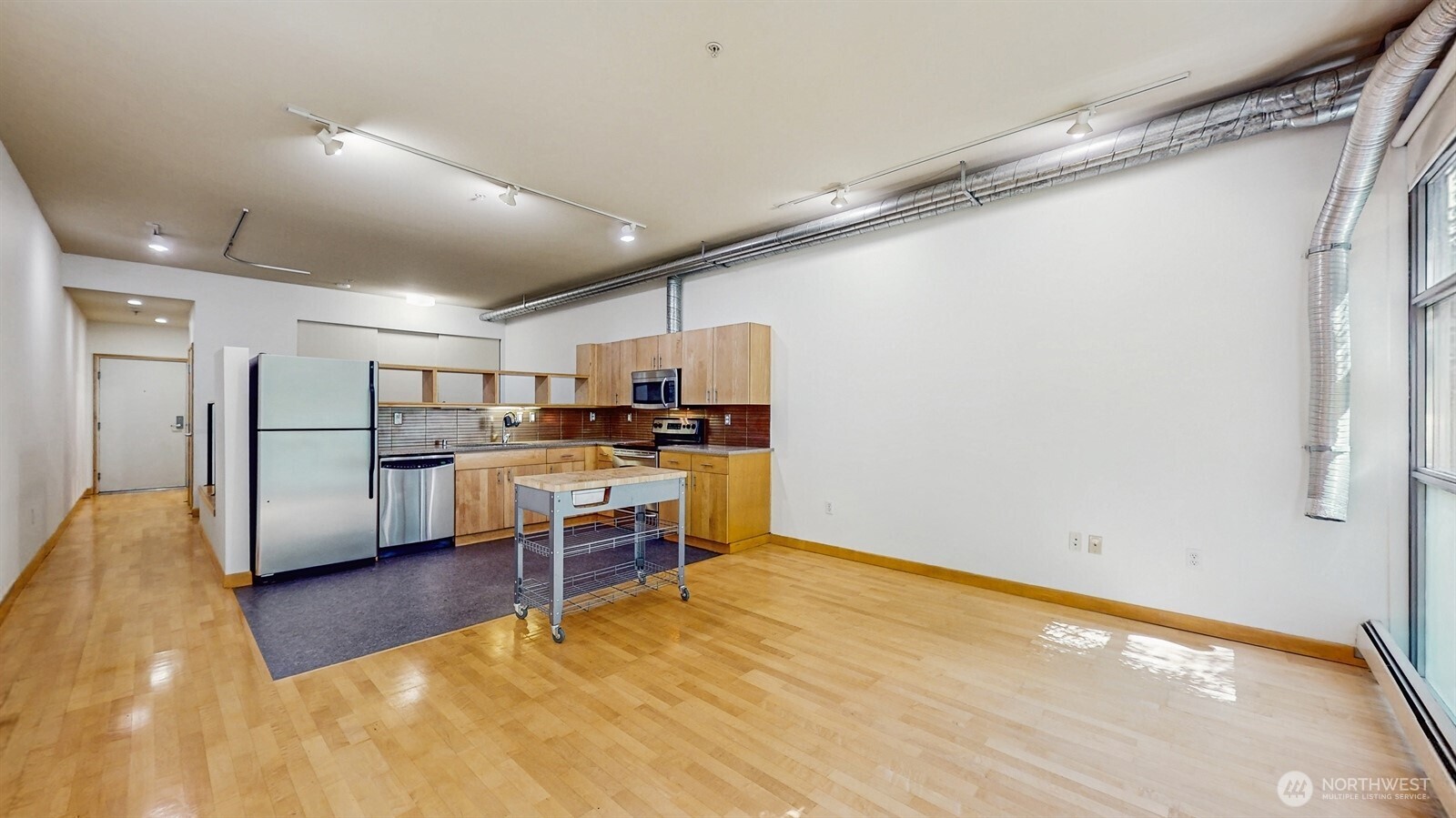 2015 Terry Avenue, Unit 301 Seattle, WA 98121 - Photo 4 of 15 a view of kitchen with furniture and refrigerator