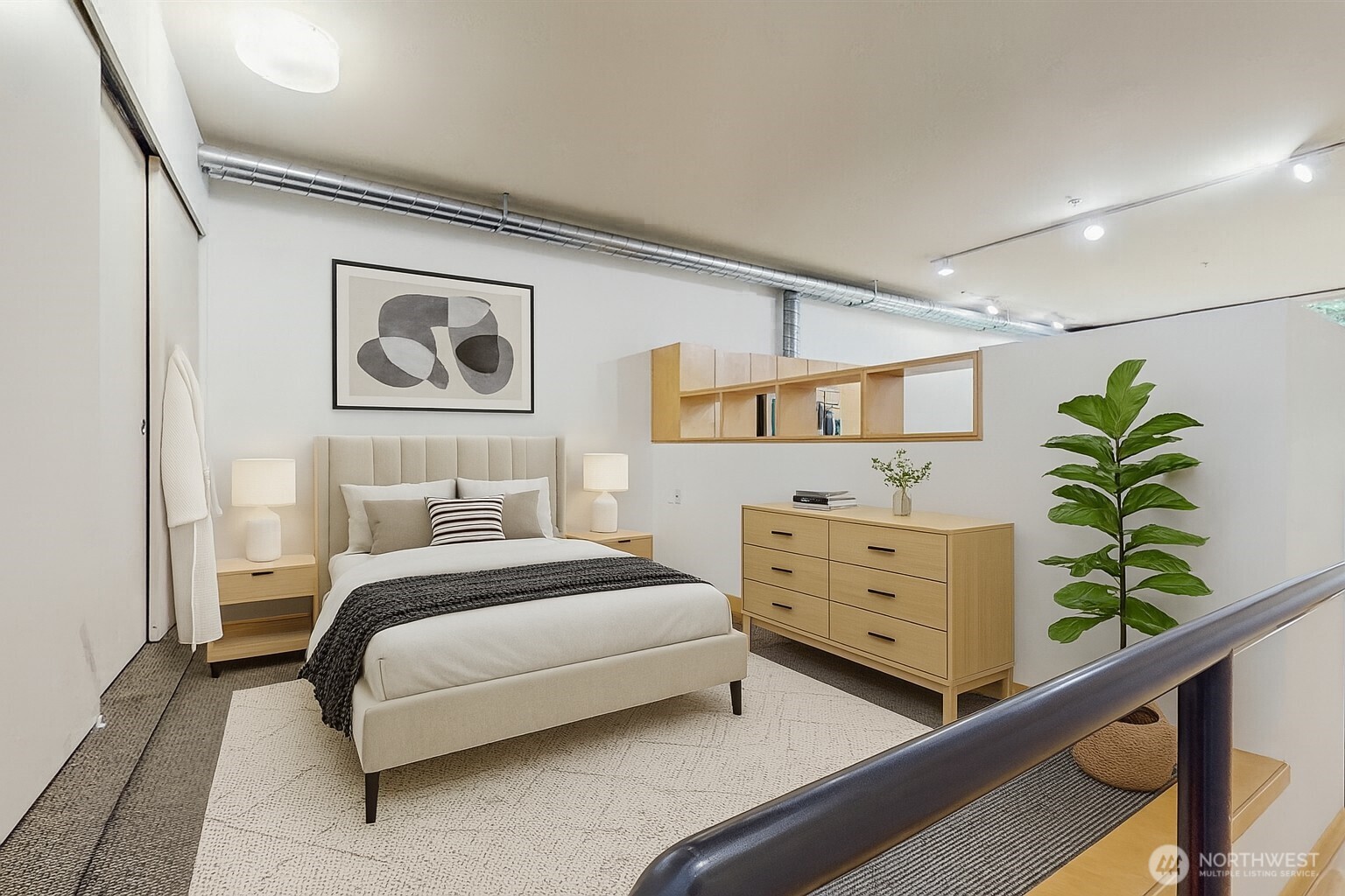 2015 Terry Avenue, Unit 301 Seattle, WA 98121 - Photo 6 of 14 a bedroom with a bed plant and window