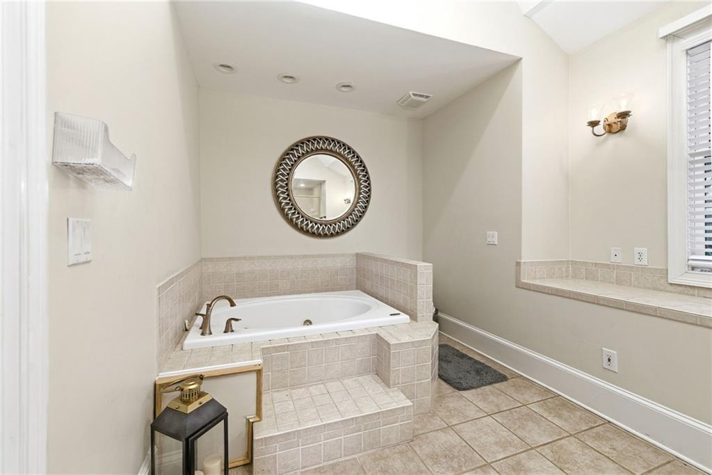 4337 Mountain View Road Oakwood, GA 30566 - Photo 26 of 84 a bathroom with a sink and a mirror