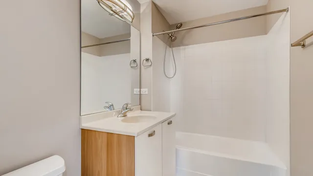 a view of an empty room with fireplace and a window