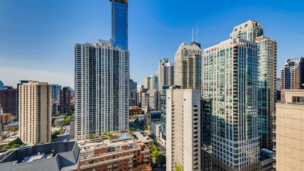 a kitchen with sink refrigerator and window