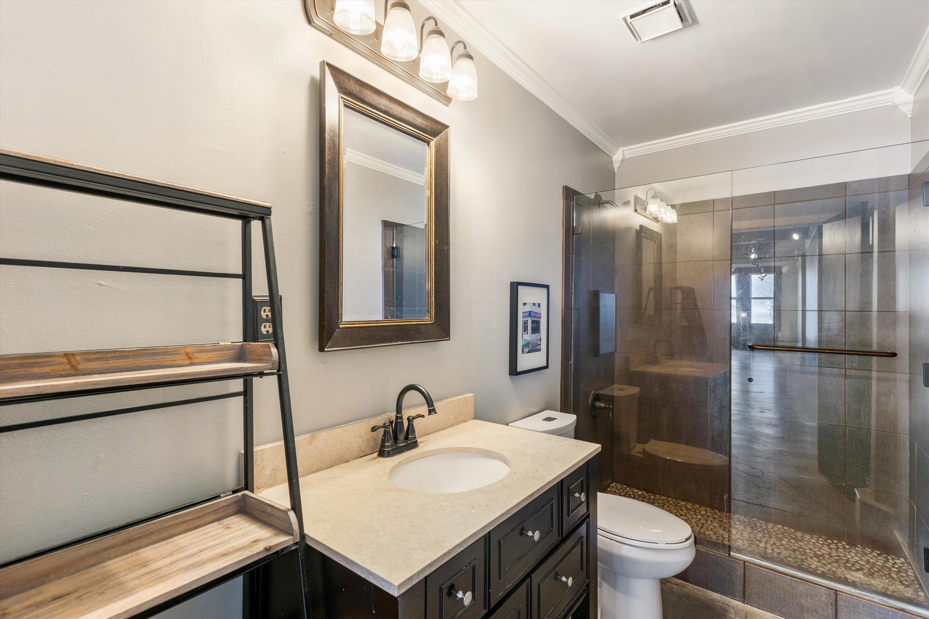 408 South Front Street, Unit 413 Memphis, TN 38103 - Photo 17 of 30 a bathroom with a sink toilet and shower