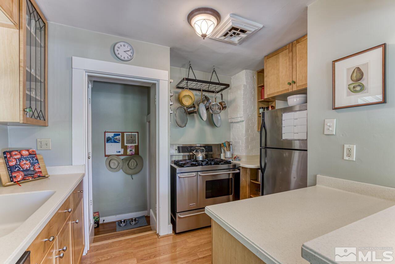 230 Martin Street Reno, NV 89509 - Photo 11 of 38 a kitchen with a refrigerator a stove a sink and a refrigerator