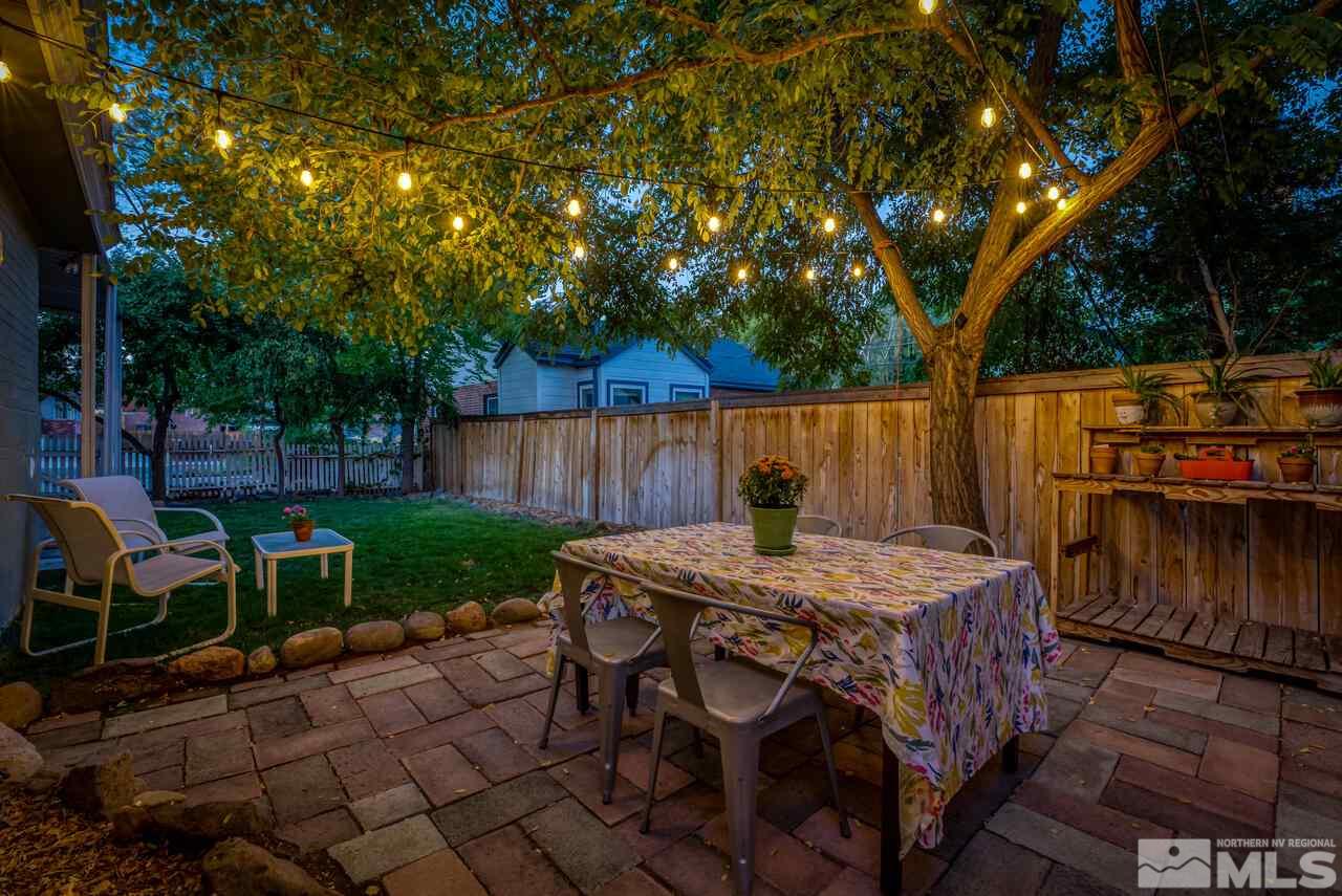 230 Martin Street Reno, NV 89509 - Photo 3 of 38 a view of a dinning table and chairs in the patio