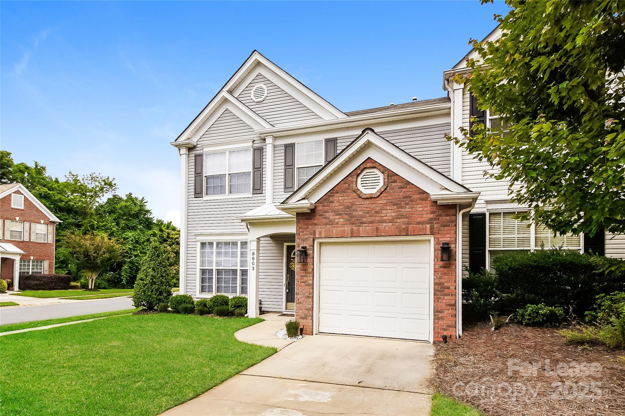 8803 Ormeau Drive Charlotte, NC 28277 - Photo 4 of 17 a front view of a house with a yard and garage