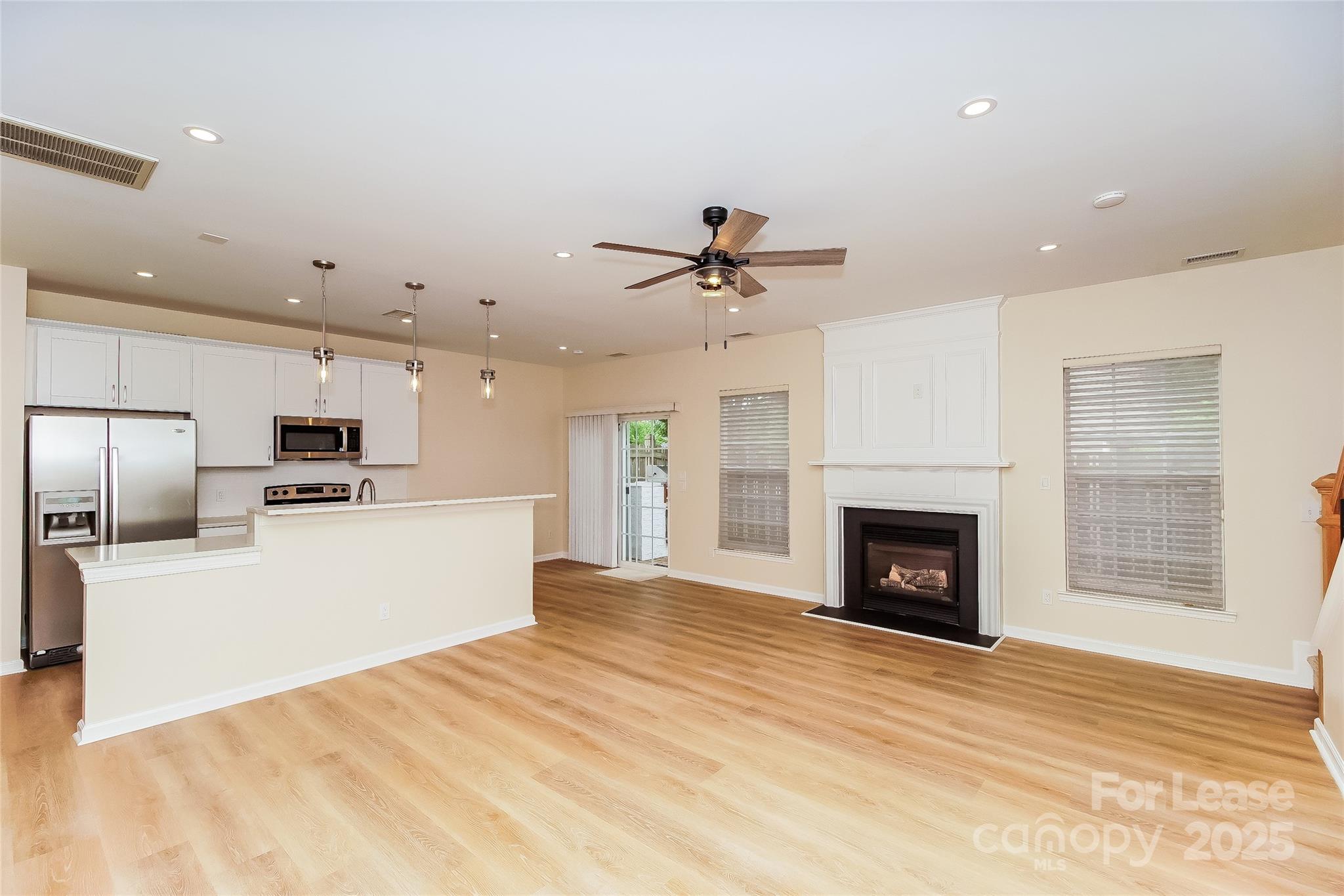 8803 Ormeau Drive Charlotte, NC 28277 - Photo 7 of 17 a view of a kitchen with a sink a refrigerator and a stove top oven