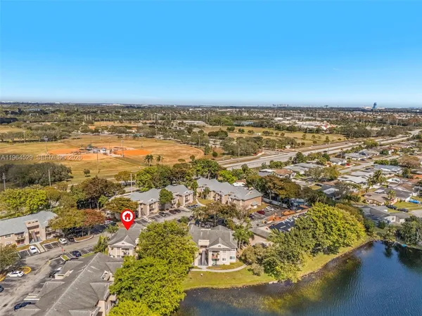 an aerial view of a houses with beach