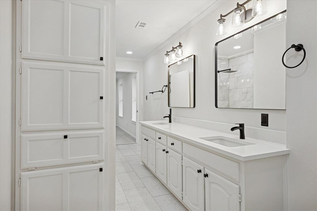 62 Legend Road Benbrook, TX 76132 - Photo 25 of 27 Upstairs jack and Jill bathroom with dual sinks and abundance of cabinets and storage space.