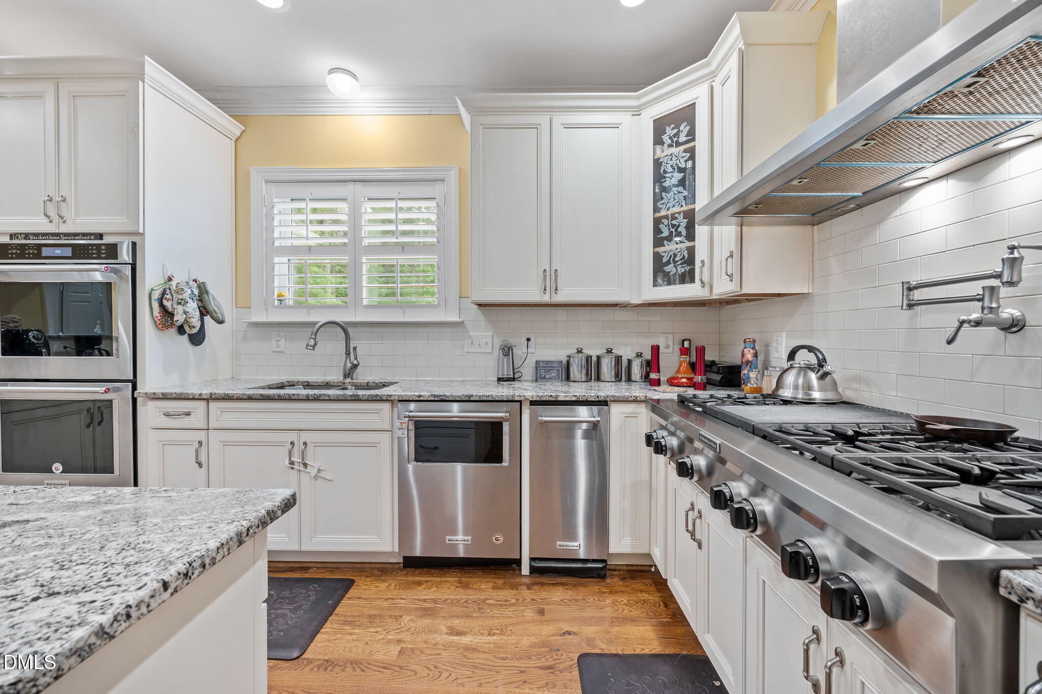 2880 Elevation Road Four Oaks, NC 27524 - Photo 22 of 51 a kitchen with stainless steel appliances granite countertop a sink stove and cabinets