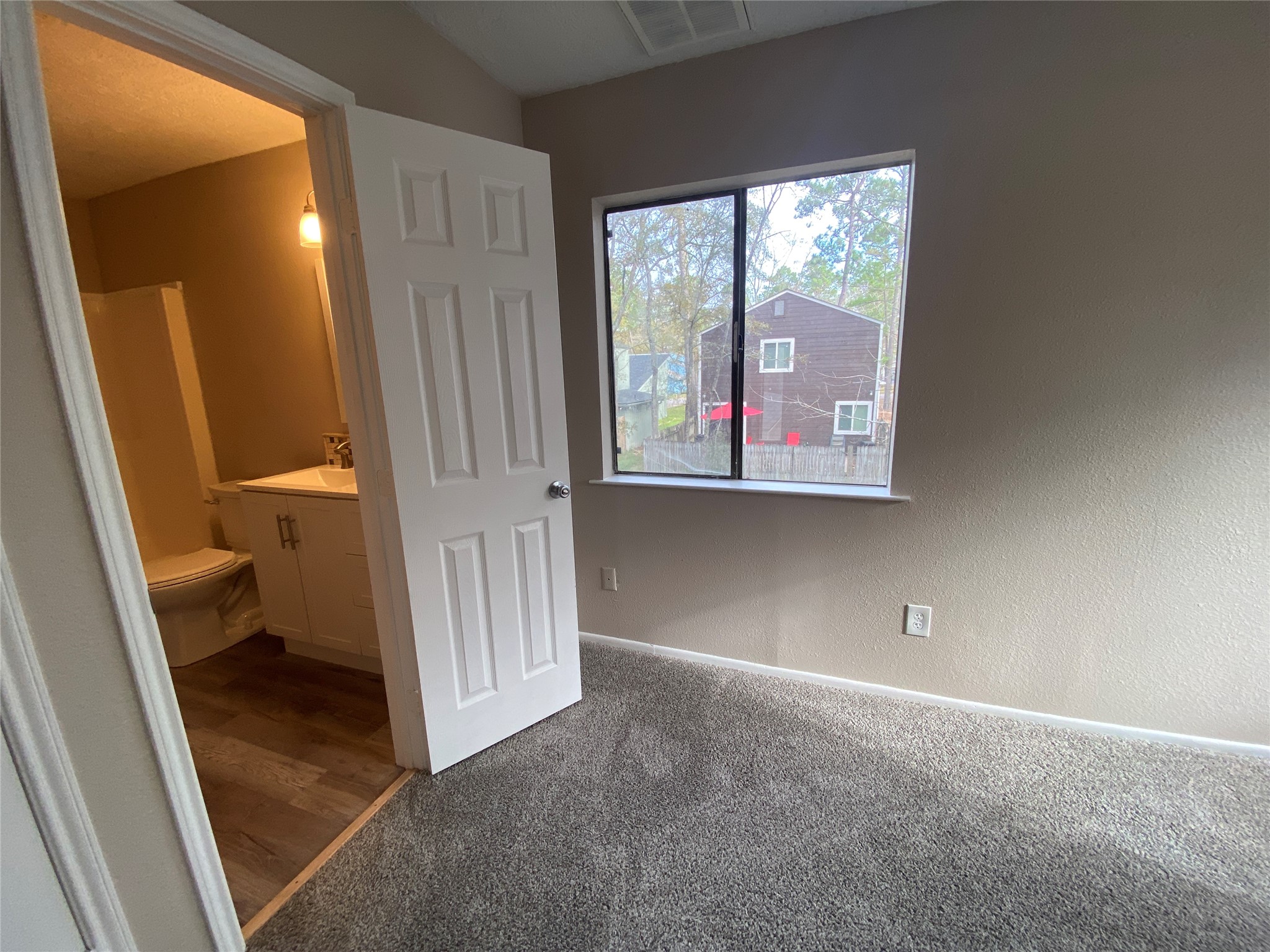 26620 Orchid Court Point Blank, TX 77364 - Photo 15 of 21 a view of a room with a hardwood and a window