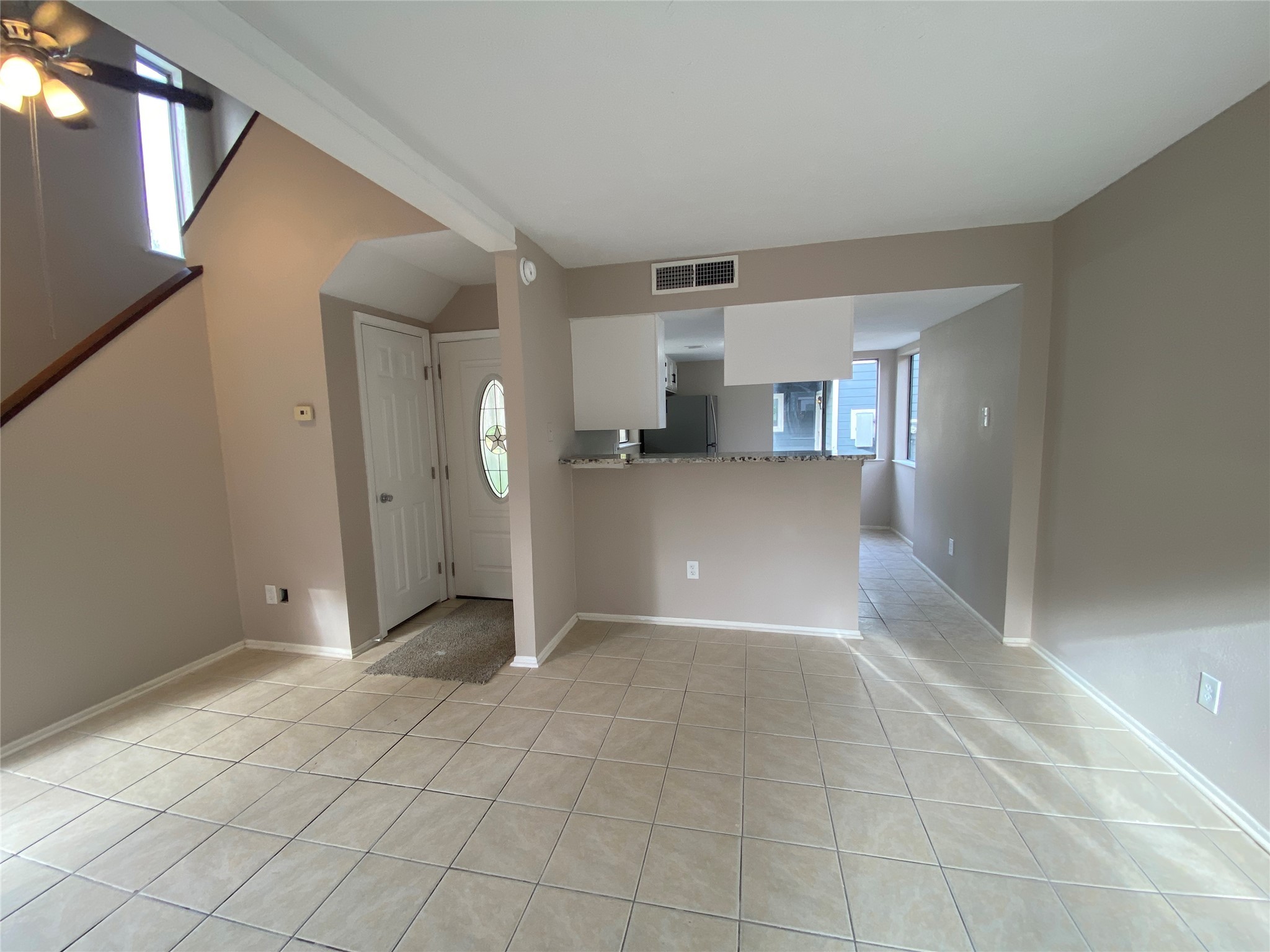 26620 Orchid Court Point Blank, TX 77364 - Photo 5 of 21 Looking backward the front door, you will see the fully updated kitchen with brand new appliances, and granite countertops!