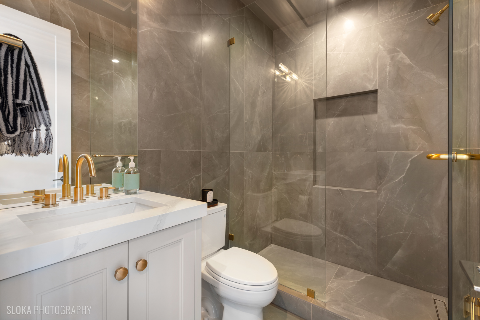 116 North Willard Court, Unit PH01 Chicago, IL 60607 - Photo 14 of 92 a bathroom with a sink toilet and shower