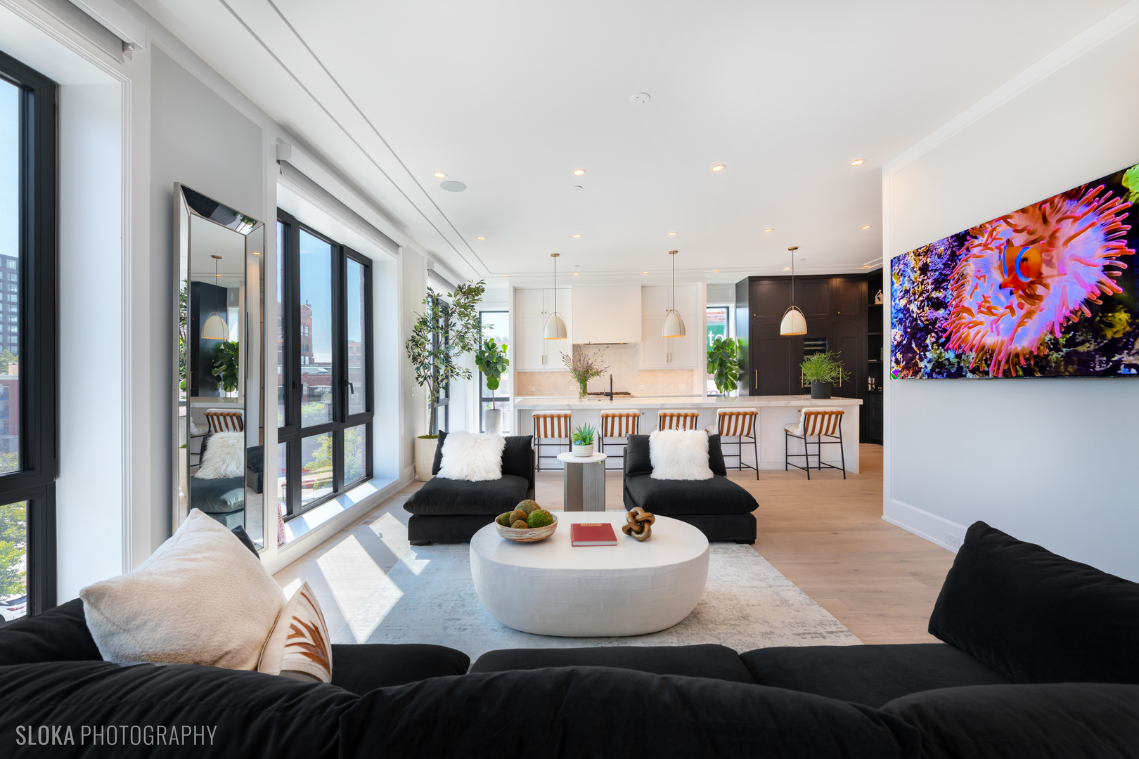 116 North Willard Court, Unit PH01 Chicago, IL 60607 - Photo 26 of 92 a living room with furniture and a large window