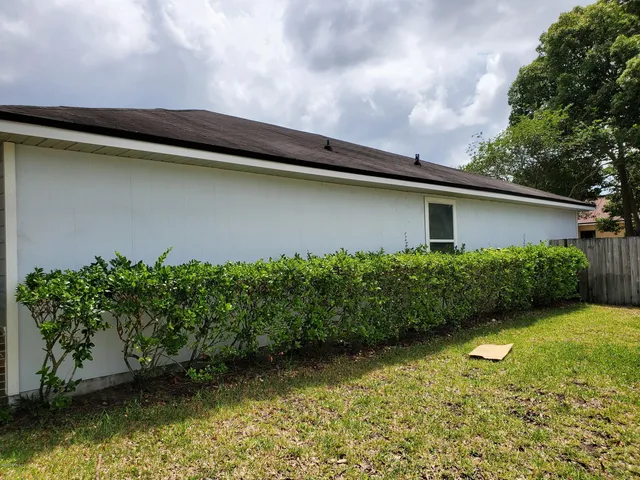 a backyard of a house with lots of green space