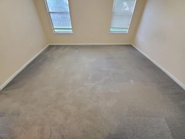 a view of a big room with carpet