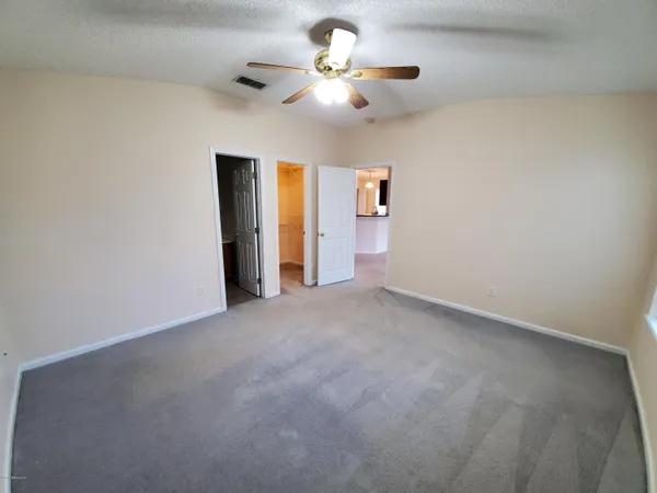 a view of a kitchen with wooden floor