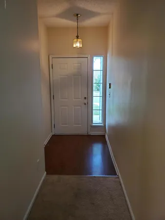 a view of a bathroom with a shower and a sink