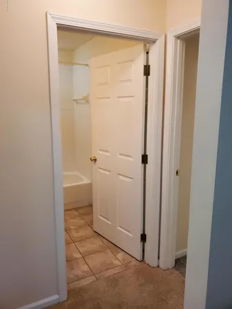 a bathroom with a toilet and a bathtub