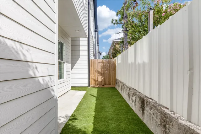 a view of a backyard with potted plants