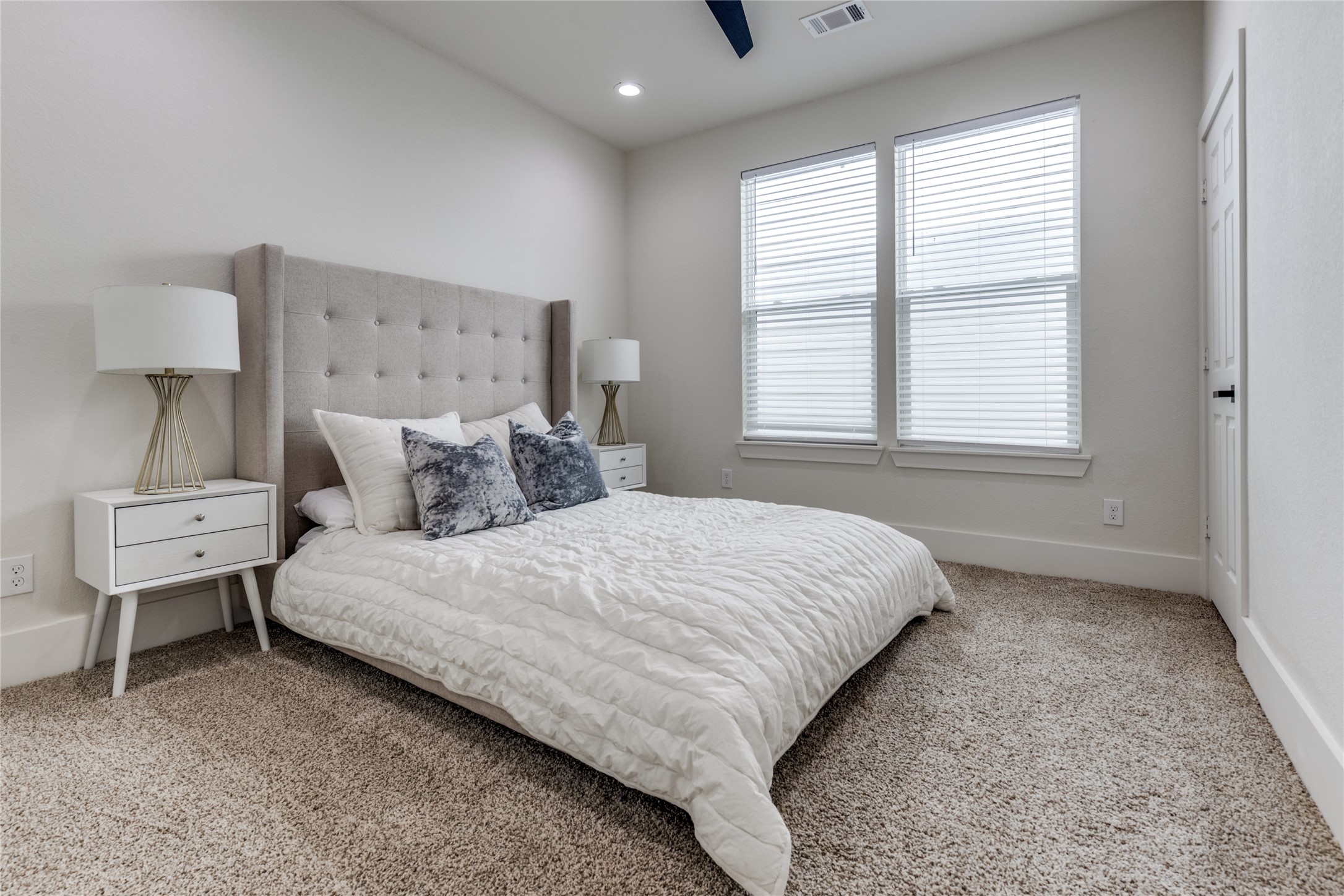 5618 Canal Street Houston, TX 77011 - Photo 6 of 12 Bed room 2 is located upstairs with a neutral color carpet.