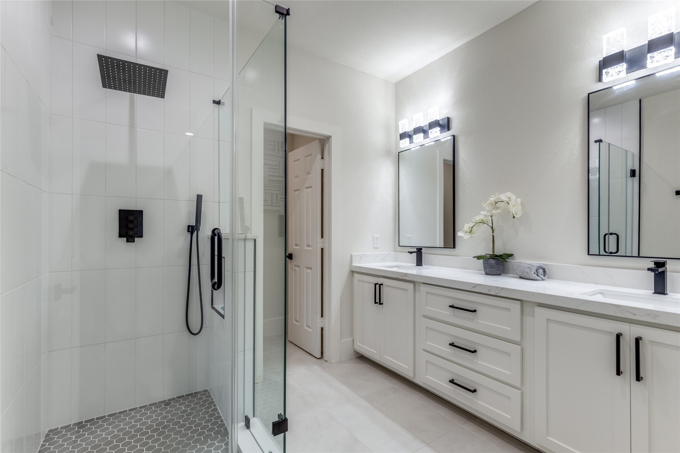 5618 Canal Street Houston, TX 77011 - Photo 10 of 12 Primary Bathroom with a rain shower head. Double vanity. Walk in closet.