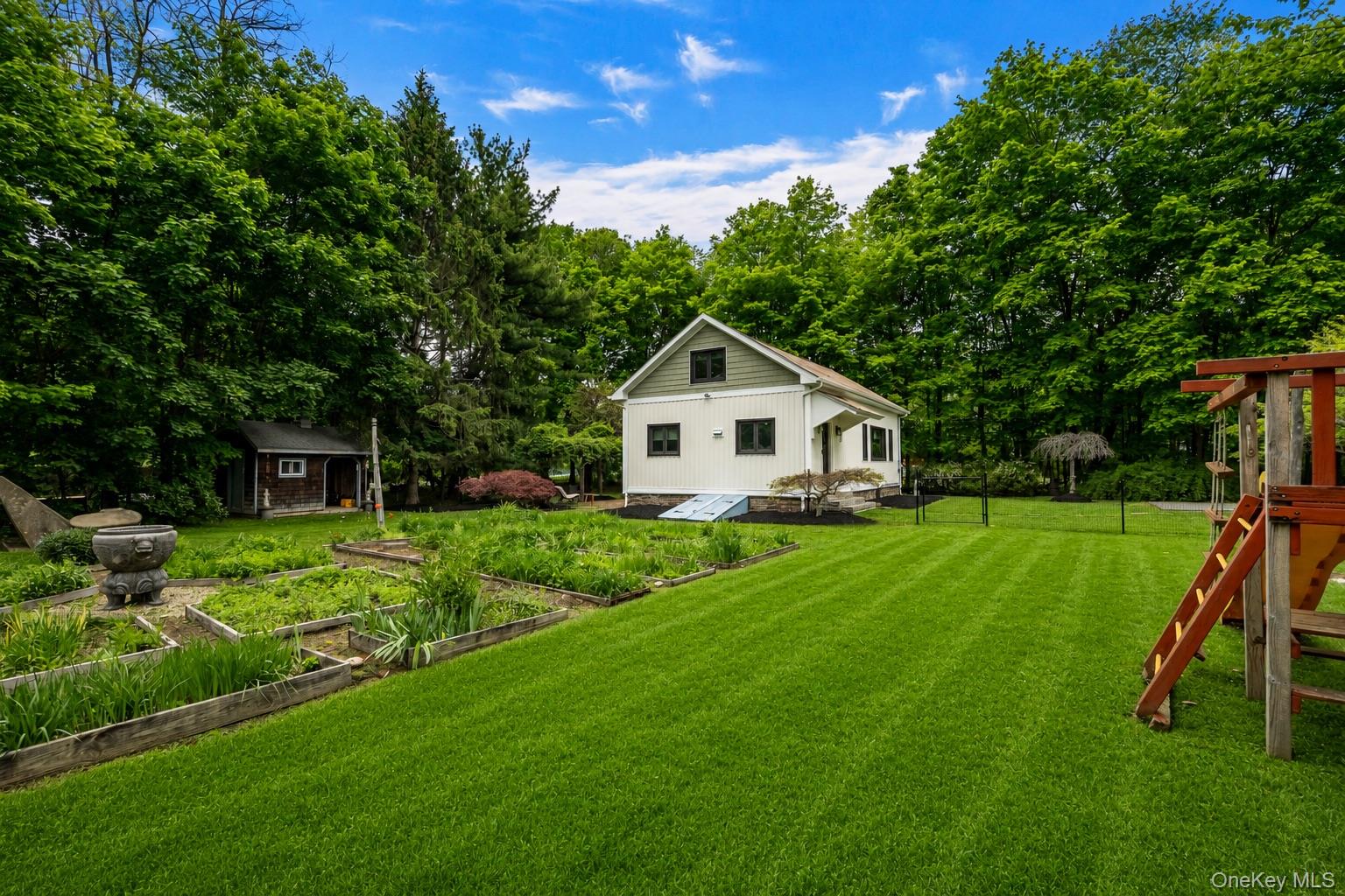4 Clove Branch Road Hopewell Junction, NY 12533 - Photo 2 of 32 a front view of a house with a yard and trees