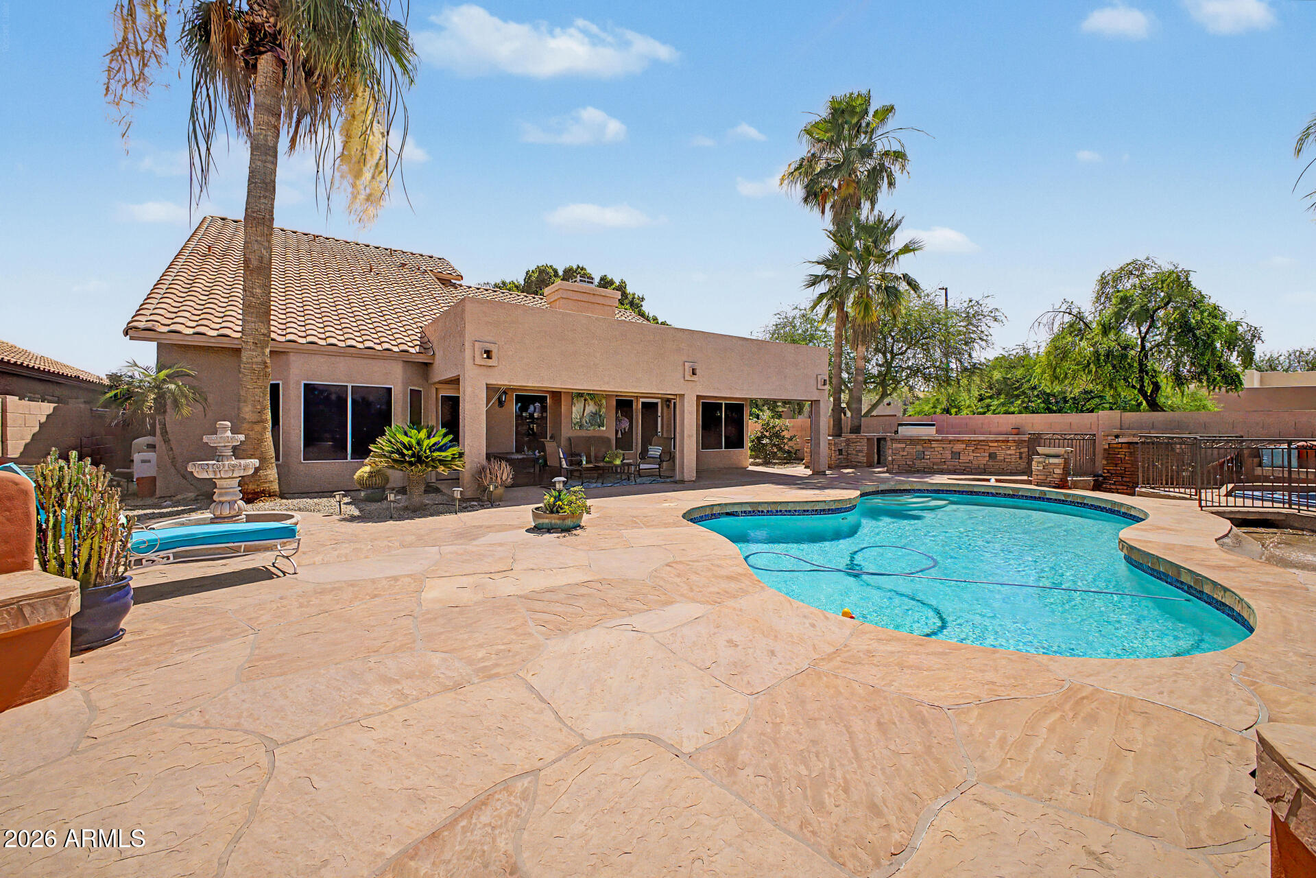 3948 North Ranier Mesa, AZ 85215 - Photo 42 of 69 a view of a house with a swimming pool and a patio