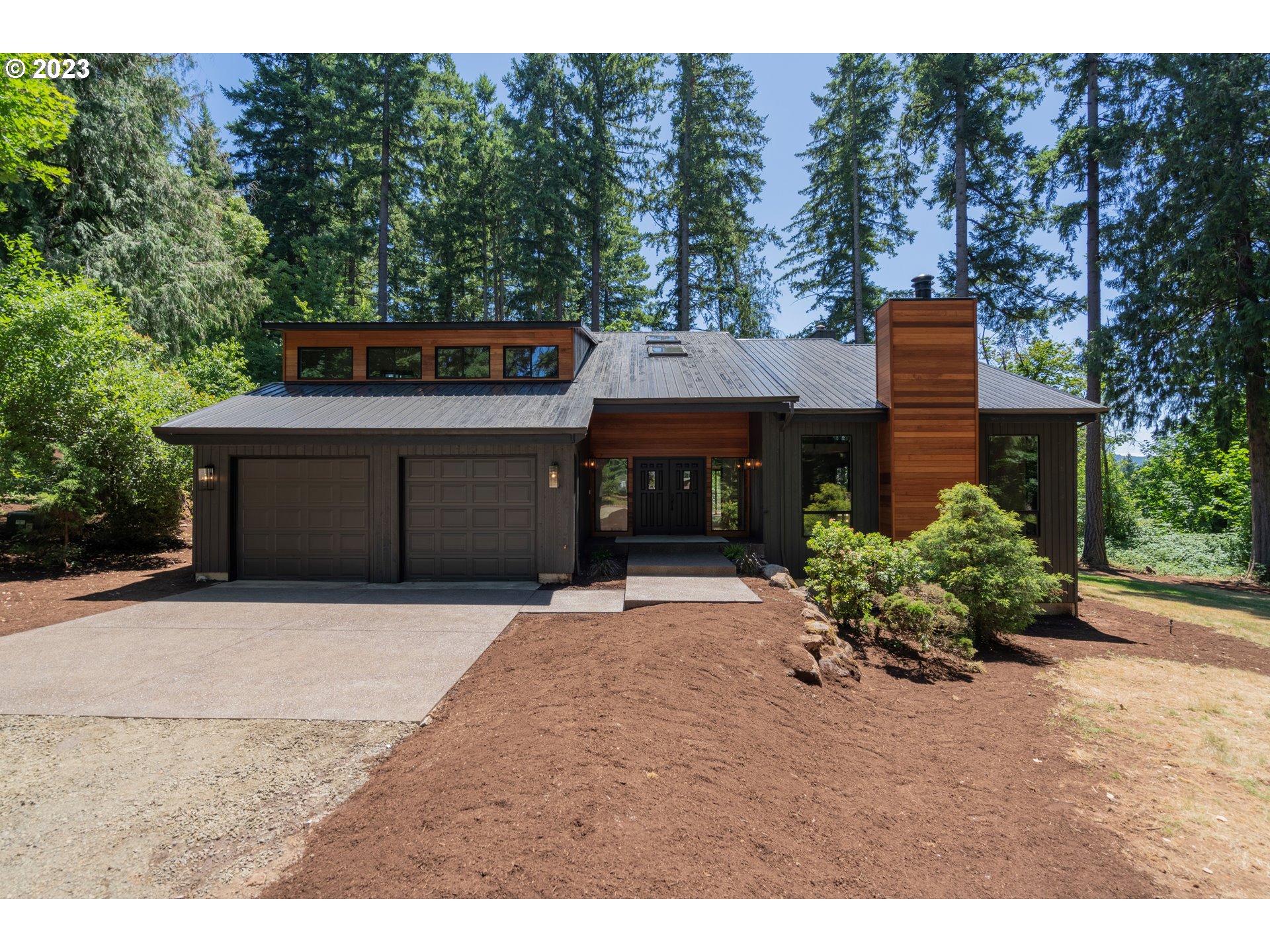 19040 South Mattoon Road Estacada, OR 97023 - Photo 1 of 46 a front view of a house with a yard and garage