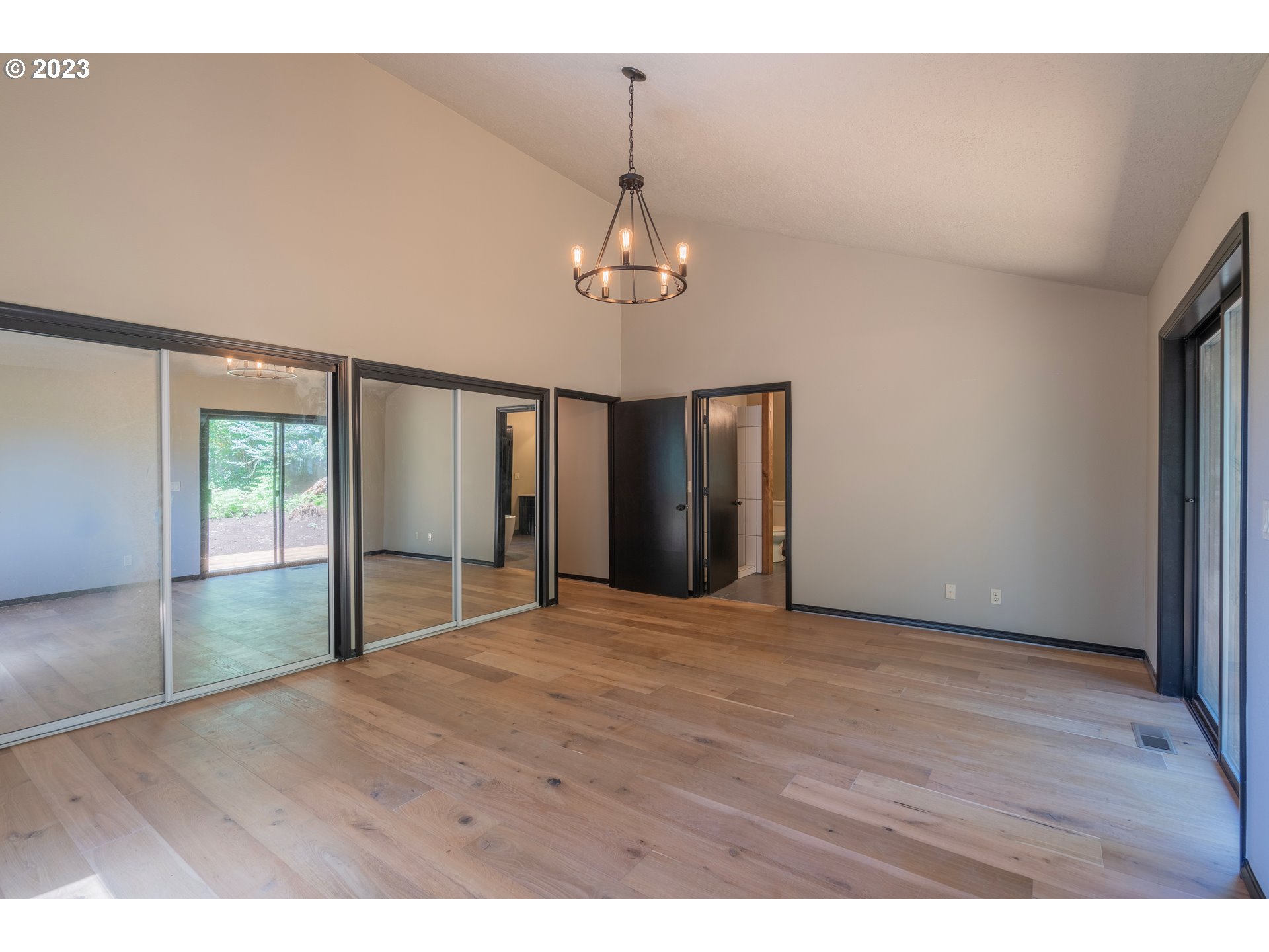 19040 South Mattoon Road Estacada, OR 97023 - Photo 17 of 46 a view of an empty room with wooden floor and a window