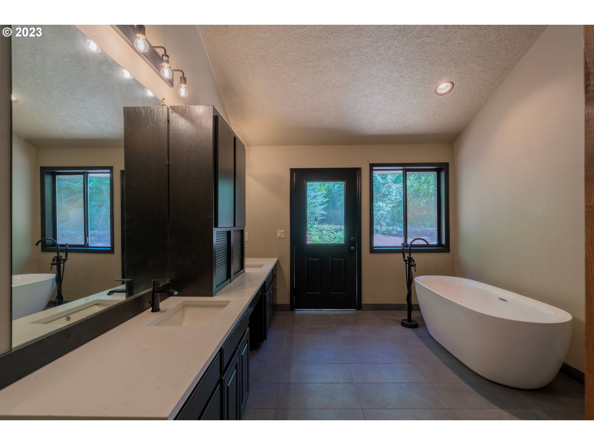 19040 South Mattoon Road Estacada, OR 97023 - Photo 19 of 46 a bathroom with a sink and a large mirror