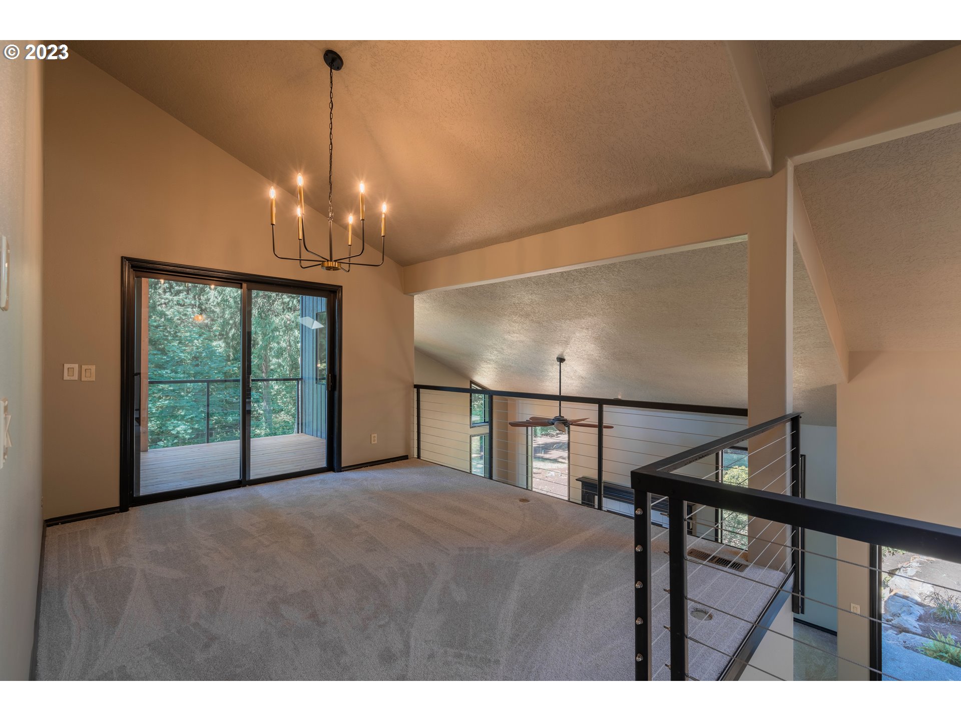 19040 South Mattoon Road Estacada, OR 97023 - Photo 22 of 46 a view of an empty room with wooden floor and windows