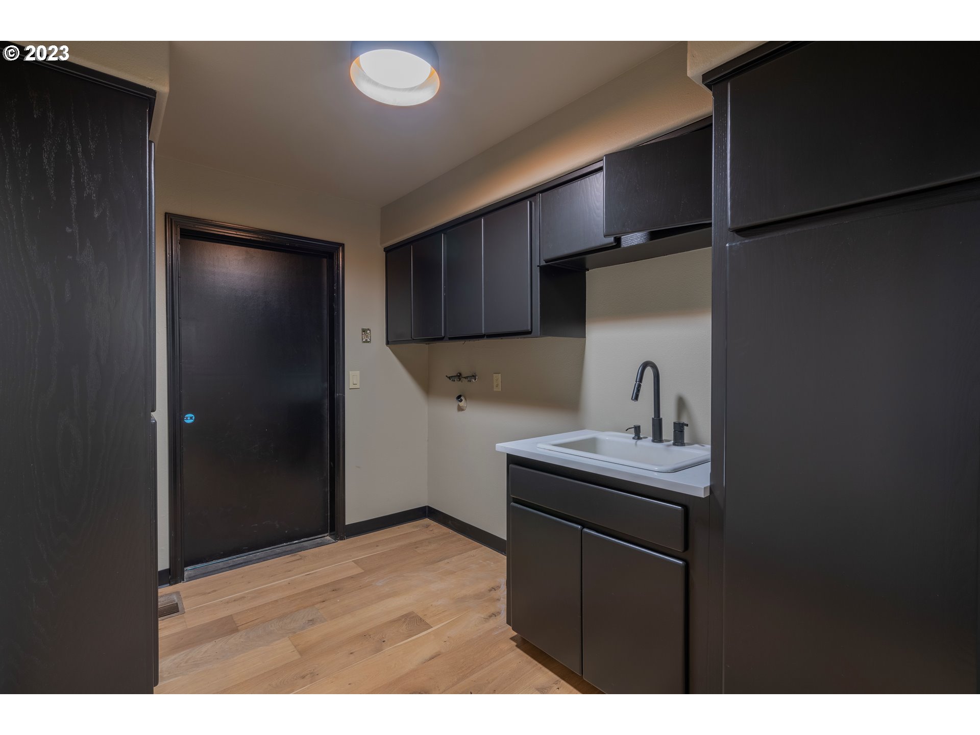19040 South Mattoon Road Estacada, OR 97023 - Photo 32 of 46 a kitchen with a sink cabinets and wooden floor