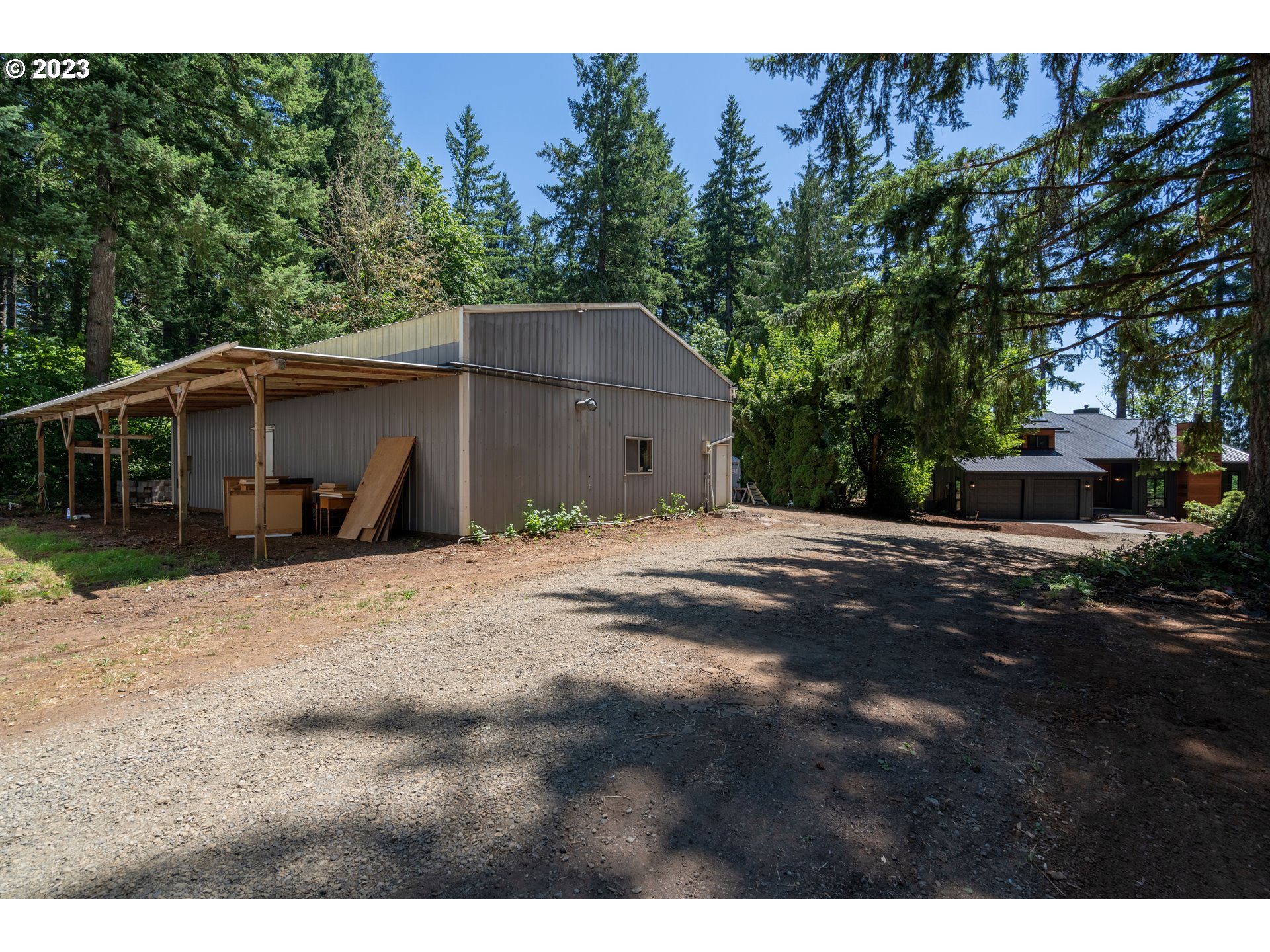 19040 South Mattoon Road Estacada, OR 97023 - Photo 39 of 46 a view of a house with a yard and tree