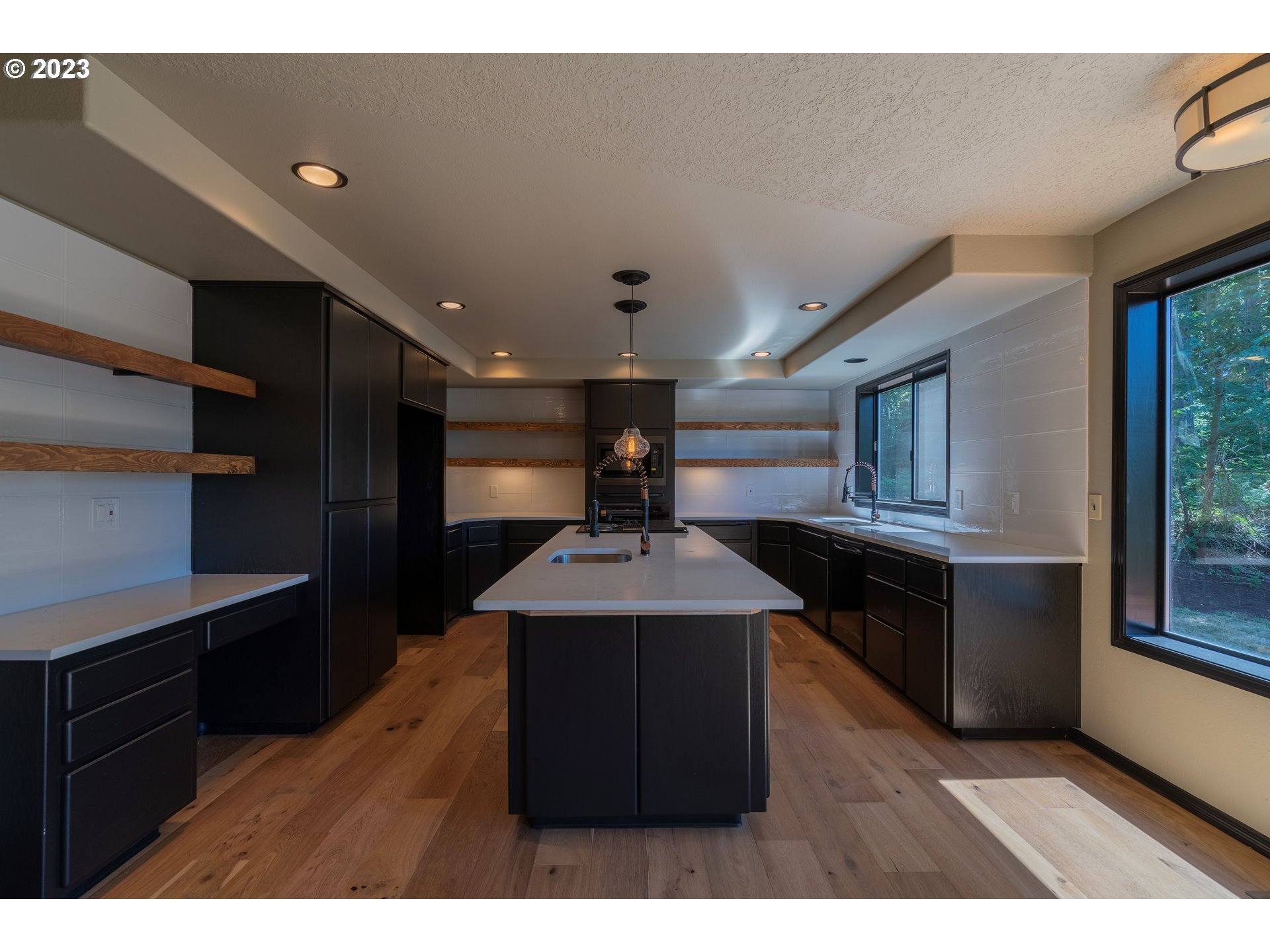 19040 South Mattoon Road Estacada, OR 97023 - Photo 10 of 46 a kitchen with kitchen island granite countertop a sink cabinets and stainless steel appliances