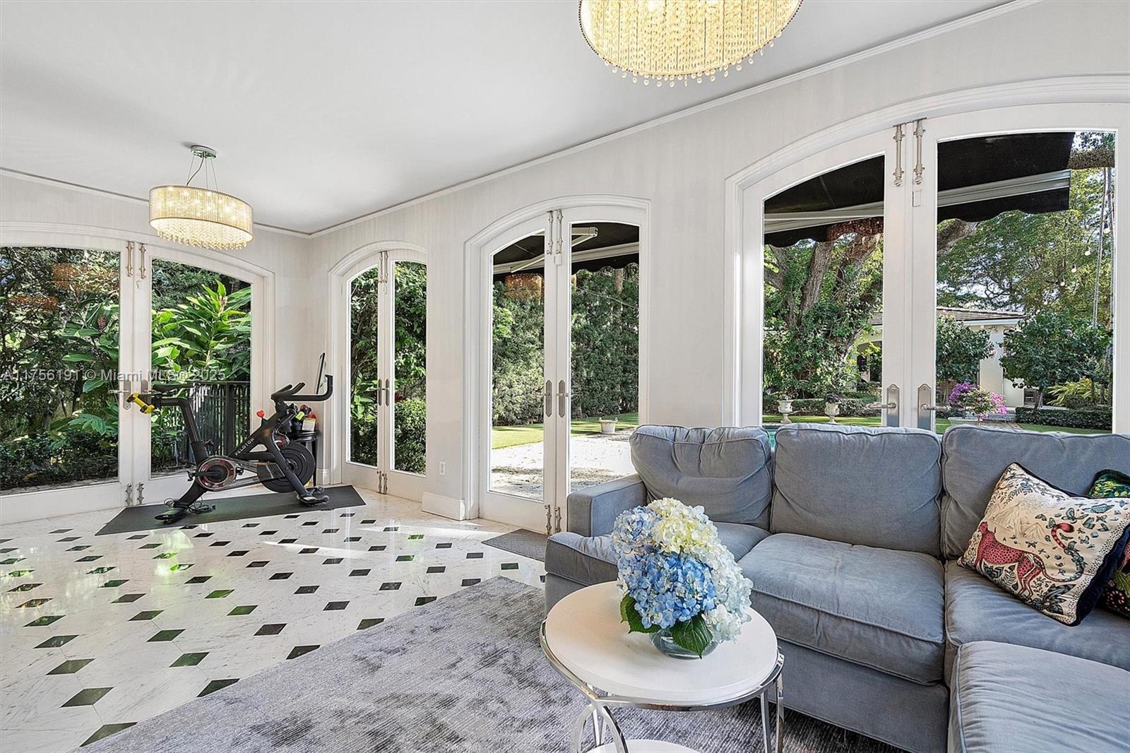 524 Hardee Road Coral Gables, FL 33146 - Photo 16 of 48 a living room with furniture large window and chairs