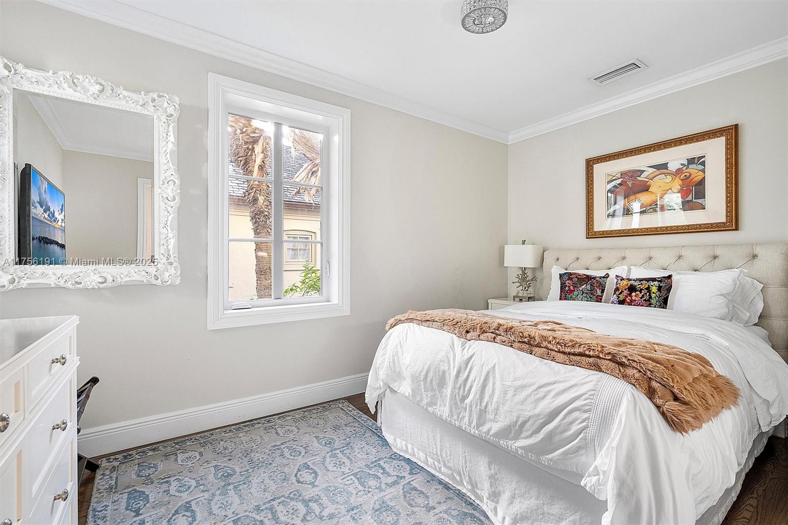 524 Hardee Road Coral Gables, FL 33146 - Photo 31 of 48 a bedroom with a bed and a window